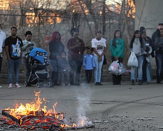 Youngstown residents gather around a bonfire during the Youngstown Peace Walk and Bonfire under the Market St. Bridge in downtown Youngstown, Sunday, Feb. 19, 2017. ..(Nikos Frazier | The Vindicator)..