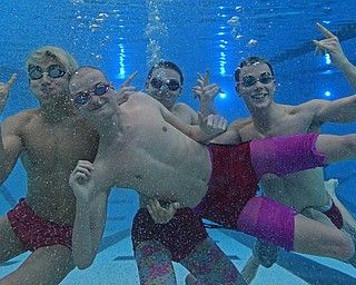 YOUNGSTOWN, OHIO - FEBRUARY 20, 2017: Cullen Brady (front) (LtoR) Kamran Sarac, Bobby Kutsch, Luke Bennett pose for a picture underwater inside the natatorium at Youngstown State University, Monday afternoon. DAVID DERMER | THE VINDICATOR