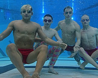 YOUNGSTOWN, OHIO - FEBRUARY 20, 2017: Kamran Sarac, Bobby Kutsch, Luke Bennett and Cullen Brady pose for a picture underwater inside the natatorium at Youngstown State University, Monday afternoon. DAVID DERMER | THE VINDICATOR