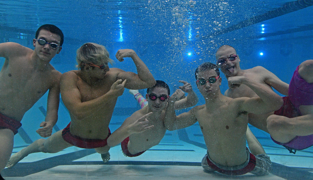 YOUNGSTOWN, OHIO - FEBRUARY 20, 2017: Jason Paris, Kamran Sarac, Bobby Kutsch, Luke Bennett and Cullen Brady pose for a picture underwater inside the natatorium at Youngstown State University, Monday afternoon. DAVID DERMER | THE VINDICATOR