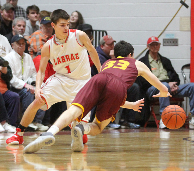 Anthony Ritter(33) of South Range dives for his loose ball as Mike Eakins(1) of LaBrae watches on during the 2nd quarter as South Range takes on LaBrae, Tuesday, Feb. 21, 2017 at LaBrae High School in Leavittsburg. LaBrae won 55-50...(Nikos Frazier | The Vindicator)..