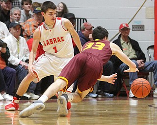 Anthony Ritter(33) of South Range dives for his loose ball as Mike Eakins(1) of LaBrae watches on during the 2nd quarter as South Range takes on LaBrae, Tuesday, Feb. 21, 2017 at LaBrae High School in Leavittsburg. LaBrae won 55-50...(Nikos Frazier | The Vindicator)..