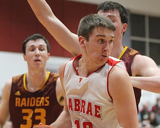 Logan Kiser(10) of LaBrae looks for an open teammate as he is boxed out under the basket during the 2nd quarter as South Range takes on LaBrae, Tuesday, Feb. 21, 2017 at LaBrae High School in Leavittsburg. LaBrae won 55-50...(Nikos Frazier | The Vindicator)..