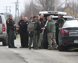       ROBERT K. YOSAY  | THE VINDICATOR..Swat team members arrive - and are briefed (CRT TEAM)..GOSHEN Ñ Mahoning County Sheriff Jerry Greene said a suspect is dead from "apparent suicide" after shots were fired as deputies tried to serve a civil order of protection at about 11:20 a.m... .-30-