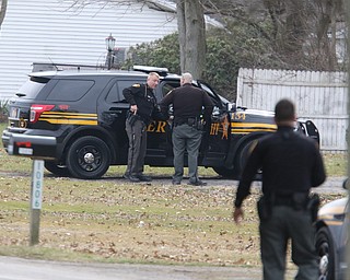        ROBERT K. YOSAY  | THE VINDICATOR..GOSHEN Ñ Mahoning County Sheriff Jerry Greene said a suspect is dead from "apparent suicide" after shots were fired as deputies tried to serve a civil order of protection at about 11:20 a.m... .-30-