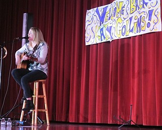 Neighbors | Alexis Bartolomucci.Katy Collins sang and played her guitar for the students at St. Christine on Jan. 31.