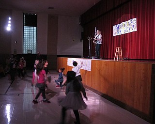 Neighbors | Alexis Bartolomucci.Students at St. Christine got close to the stage as they danced along to Katy Collins' performance on Jan. 31.