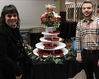 Neighbors | Abby Slanker.Julian Testa (right) and Jodie Hanna (left) of the Canfield Gorant Chocolatier store provided a variety of chocolates for tasting at the Canfield Choral Boosters ‘Blast From The Past’ Dinner Theater on Jan. 28.