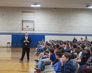 Neighbors | Alexis Bartolomucci.Seventh- and eighth-grade students at Poland Middle School listened as Mahoning County Juvenile Court Program Coordinator James DeLucia spoke to them about internet safety.