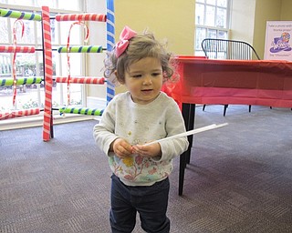 Neighbors | Alexis Bartolomucci.Isabella Pilolli played with the Willy Wonka props during the Willy Wonka program at the Poland library on Feb. 11.