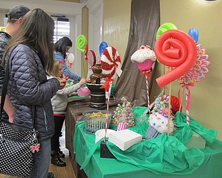 Neighbors | Alexis Bartolomucci.Guests dipped different snacks in chocolate during the Willy Wonka program at the Poland library on Feb. 11.