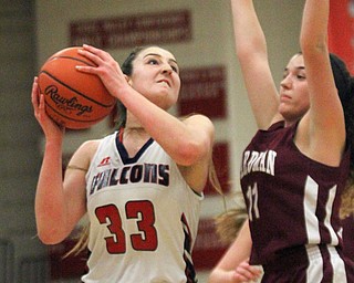 William D Lewis The Vindictor Fitch's Sabria Hunter(33) shoots past Boardman's Alicia Saxton(11) during 2-23-17 action at Fitch.