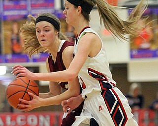 William D Lewis The Vindictor Boardman's Cate Green(13) drives around fitch's Gina DiFrancesco(3) during 2-23-17 action at Fitch.