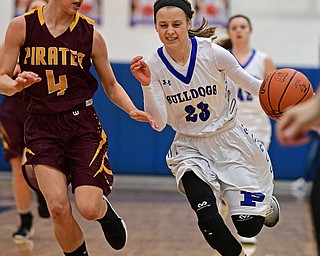 POLAND, OHIO - FEBRUARY 23, 2017: Bella Gajdos #23 of Poland drives on Leann James #4 of Southeast during the first half of their game Thursday night at Poland High School. Southeast won 72-71. DAVID DERMER | THE VINDICATOR