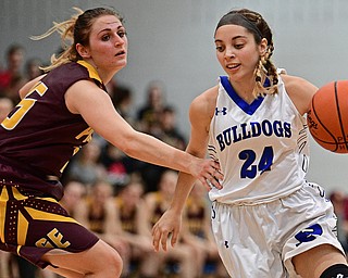 POLAND, OHIO - FEBRUARY 23, 2017: Alea Nicholudis #24 of Poland dribbles around Riley Norquest #15 of Southeast during the second half of their game Thursday night at Poland High School. Southeast won 72-71. DAVID DERMER | THE VINDICATOR