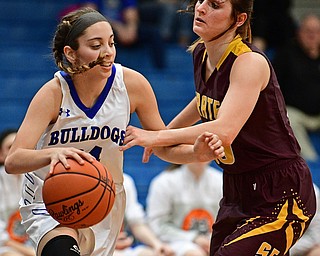 POLAND, OHIO - FEBRUARY 23, 2017: Alea Nicholudis #24 of Poland dribbles around Riley Norquest #15 of Southeast during the second half of their game Thursday night at Poland High School. Southeast won 72-71. DAVID DERMER | THE VINDICATOR