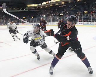 Phantoms defenseman Steve Ruggiero(28) hits the puck along the boards to clear the puck from Phantoms territory during the 1st period as the Fargo Force take on the Youngstown Phantoms, Friday, Feb. 24, 2017 at the Covelli Centre in Youngstown. The Phantoms won 2-1 in OT...(Nikos Frazier | The Vindicator)..