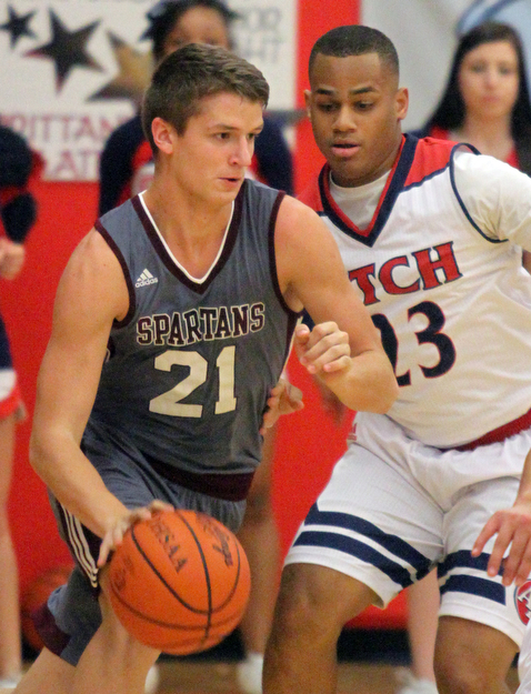 William D. Lewis The Vindicator  Boardman's Sebastian Heinonen(21) drives around Fitch's Larry HArrington (23) during 2/24/17 action at Fitch.