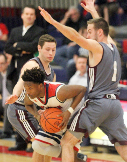 William D. Lewis The Vindicator  Fitch's Emanuel Dawkins(11) is hemmed in by Boardman's Mike Melewski(4) and John Ryan(1) during 2/24/17 action at Fitch.