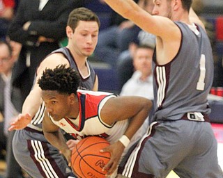 William D. Lewis The Vindicator  Fitch's Emanuel Dawkins(11) is hemmed in by Boardman's Mike Melewski(4) and John Ryan(1) during 2/24/17 action at Fitch.