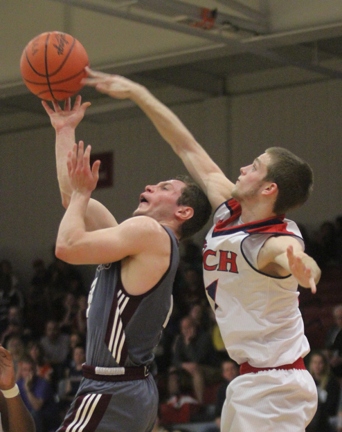 William D. Lewis The Vindicator Boardman'sMike Melewski(4) is blocked by Fitch's Sebastian Heinonen(21) during 2/24/17 action at Fitch.