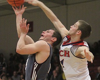 William D. Lewis The Vindicator Boardman'sMike Melewski(4) is blocked by Fitch's Sebastian Heinonen(21) during 2/24/17 action at Fitch.