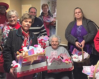 SPECIAL TO THE VINDICATOR
Members of Smith Corners United Methodist Church visited Austinwoods Care Center on Valentine’s Day for its fourth annual distribution of 150 stuffed bears to staff and residents. Visitors, from left, are Idabelle DeHoff, the Rev. Marilyn Coney, Margaret Yannucci, Sandie Reel, Rick Klacik, Rita Newbery, Terri Klacik and Gary Reel. Seated is Betty Quimby, church member and Austinwoods resident.
