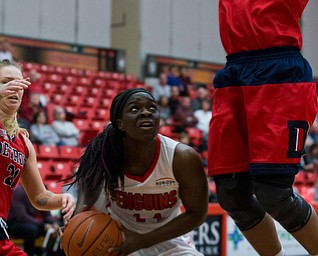 MICHAEL G TAYLOR | THE VINDICATOR- 02-25-17  -Women's  Basketball-  1st qtr., YSU's #44 Tamira Ford pump fakes Detroit Mercy's #23 Brianne Cohen.   Detroit Mercy Titans vs YSU Penguins at YSU, Beeghly Center in Youngstown, OH