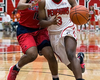 MICHAEL G TAYLOR | THE VINDICATOR- 02-25-17  -Women's  Basketball-  1st qtr., YSU's #3 Indiya Benjamin drives against Detroit Mercy's #10 Brittney Jackson.   Detroit Mercy Titans vs YSU Penguins at YSU, Beeghly Center in Youngstown, OH