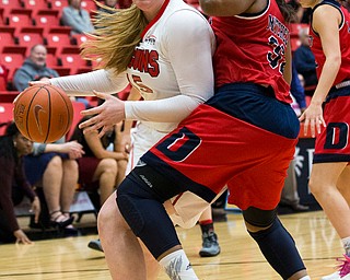 MICHAEL G TAYLOR | THE VINDICATOR- 02-25-17  -Women's  Basketball-  1st qtr., YSU's #15 Mary Dunn drives to the basket against Detroit Mercy's #32 Kelsey Mitchell. Detroit Mercy Titans vs YSU Penguins at YSU, Beeghly Center in Youngstown, OH