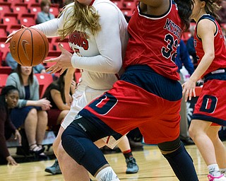 MICHAEL G TAYLOR | THE VINDICATOR- 02-25-17  -Women's  Basketball-  1st qtr., YSU's #15 Mary Dunn drives to the basket against Detroit Mercy's #32 Kelsey Mitchell.  Detroit Mercy Titans vs YSU Penguins at YSU, Beeghly Center in Youngstown, OH