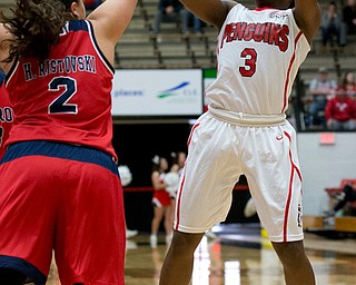 MICHAEL G TAYLOR | THE VINDICATOR- 02-25-17  -Women's  Basketball-  1st qtr., YSU's #3 Indiya Benjamin shoots over the out stretched hand of Detroit Mercy's #2 Haleigh Ristovski.  Detroit Mercy Titans  vs YSU Penguins at YSU, Beeghly Center in Youngstown, OH