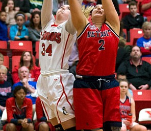 MICHAEL G TAYLOR | THE VINDICATOR- 02-25-17  -Women's  Basketball-  2nd qtr., YSU's #34 Morgan Brunner and Detroit Mercy's #2 Haleigh Ristovski battle for the rebound.  Detroit Mercy Titans  vs YSU Penguins at YSU, Beeghly Center in Youngstown, OH