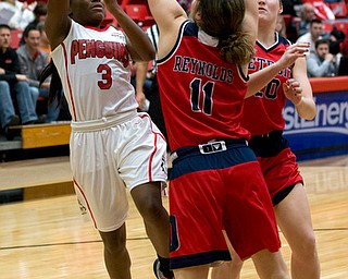 MICHAEL G TAYLOR | THE VINDICATOR- 02-25-17  -Women's  Basketball-  3rd qtr., YSU's #3 Indiya Benjamin shoots against the defense ofDetroit Mercy's #11 Rosanna Reynolds and #20 Nicole Urbanick.   Detroit Mercy Titans vs YSU Penguins at YSU, Beeghly Center in Youngstown, OH