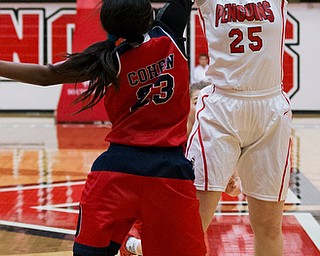 MICHAEL G TAYLOR | THE VINDICATOR- 02-25-17  -Women's  Basketball-  3rd qtr., YSU's #25 Morgan Olson has her shot deflected by Detroit Mercy's #23 Brianne Cohen. Detroit Mercy Titans vs YSU Penguins at YSU, Beeghly Center in Youngstown, OH