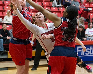 MICHAEL G TAYLOR | THE VINDICATOR- 02-25-17  -Women's  Basketball-  3rd qtr., YSU's #2 Alison Smolinski drives against Detroit Mercy's #11 Rosanna Reynolds and Detroit Mercy's #32 Kelsey Mitchell. Detroit Mercy Titans vs YSU Penguins at YSU, Beeghly Center in Youngstown, OH