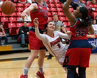 MICHAEL G TAYLOR | THE VINDICATOR- 02-25-17  -Women's  Basketball-  3rd qtr., YSU's #2 Alison Smolinski drives against Detroit Mercy's #11 Rosanna Reynolds and Detroit Mercy's #32 Kelsey Mitchell. Detroit Mercy Titans vs YSU Penguins at YSU, Beeghly Center in Youngstown, OH
