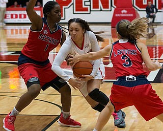 MICHAEL G TAYLOR | THE VINDICATOR- 02-25-17  -Women's  Basketball-  4th qtr., YSU's #10 Mailee Jones drives between Detroit Mercy's #1 Ashley Miller and Detroit Mercy's #3 Lola Ristovski. Detroit Mercy Titans vs YSU Penguins at YSU, Beeghly Center in Youngstown, OH
