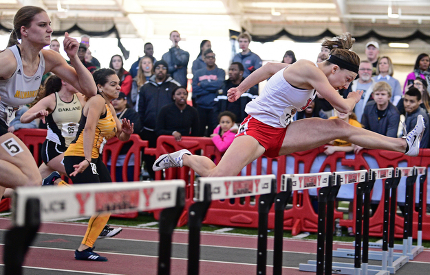 YOUNGSTOWN, OHIO - FEBRUARY 26, 2017: Amber Eles of Youngstown State clears a hurdle on her way to the finish line to finish first in the women's 60 meter hurdles during the Horizon League Championship track meet, Sunday afternoon at Youngstown State. DAVID DERMER | THE VINDICATOR