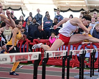 YOUNGSTOWN, OHIO - FEBRUARY 26, 2017: Amber Eles of Youngstown State clears a hurdle on her way to the finish line to finish first in the women's 60 meter hurdles during the Horizon League Championship track meet, Sunday afternoon at Youngstown State. DAVID DERMER | THE VINDICATOR