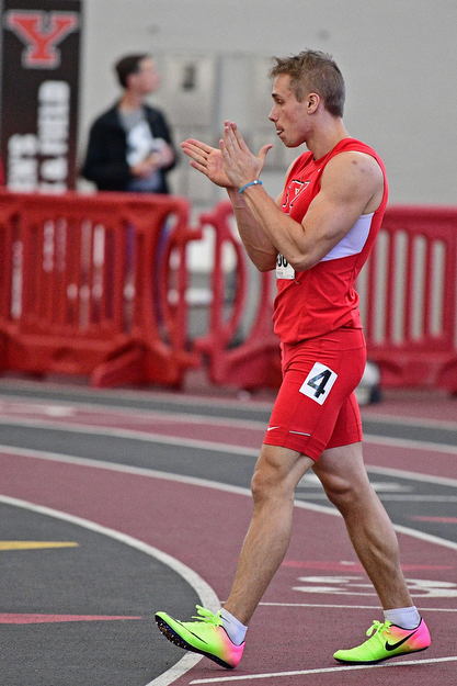YOUNGSTOWN, OHIO - FEBRUARY 26, 2017: Chad Zallow of YSU claps while leaving the track after seeing his time on the scoreboard during the Horizon League Championship track meet, Sunday afternoon at Youngstown State. DAVID DERMER | THE VINDICATOR