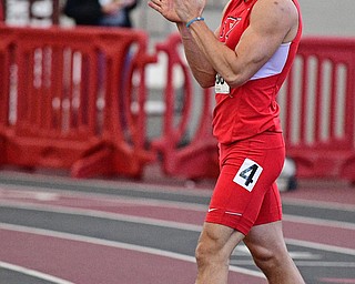 YOUNGSTOWN, OHIO - FEBRUARY 26, 2017: Chad Zallow of YSU claps while leaving the track after seeing his time on the scoreboard during the Horizon League Championship track meet, Sunday afternoon at Youngstown State. DAVID DERMER | THE VINDICATOR