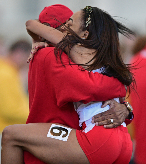 YOUNGSTOWN, OHIO - FEBRUARY 26, 2017: Taylor Thompkins gets a hug from her father Eric Thompkins, of Canton after she finished first in the women's 60m dash during the Horizon League Championship track meet, Sunday afternoon at Youngstown State. DAVID DERMER | THE VINDICATOR