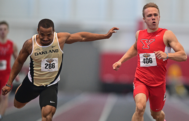 YOUNGSTOWN, OHIO - FEBRUARY 26, 2017: Chad Zallow of YSU looks to the scoreboard for the time after finishing ahead of Aaron Davis of Oakland during the men's 200m dash during the Horizon League Championship track meet, Sunday afternoon at Youngstown State. DAVID DERMER | THE VINDICATOR