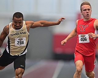 YOUNGSTOWN, OHIO - FEBRUARY 26, 2017: Chad Zallow of YSU looks to the scoreboard for the time after finishing ahead of Aaron Davis of Oakland during the men's 200m dash during the Horizon League Championship track meet, Sunday afternoon at Youngstown State. DAVID DERMER | THE VINDICATOR