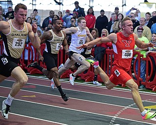 YOUNGSTOWN, OHIO - FEBRUARY 26, 2017: Chad Zallow of YSU sprints to the finish line ahead of Aaron Davis and Nicholas Girodat of Oakland and Nate Pozolinski of Wisconsin-Milwaukee to finish first during the men's 60 meter dash during the Horizon League Championship track meet, Sunday afternoon at Youngstown State. DAVID DERMER | THE VINDICATOR