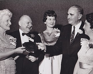 Jerold S. Meyer (second from right), general manager of Strouss--Hirshberg Co., receives a plaque designating him as "Boss of the Year" from Mrs. Marie Dunn, president of Youngstown chapter, American Business Women's Association, at the groups annual Bosses' Night banquet Tuesday at Mural Room. Others (left to right) are Dr. Beryl D. Orris, human relations authority, Miss Annabelle Brooking, toastmistress and Mrs. Ruth Sebulsky, honored by the group as "woman of the Year"