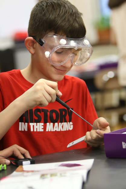       ROBERT K. YOSAY  | THE VINDICATOR..Noah Rouhan   puts together a game piece ..a grant from the Poland schools foundation, a middle school program has some new materials for STEAM -- science, technology, engineering, arts, mathetmatics ÐÐ programs.. .-30-