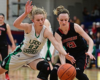 AUSTINTOWN, OHIO - FEBRUARY 27, 2017: Kayla Hovorka #23 of West Branch knocks the ball away from Alexis Bury #13 of Struthers during the second half of their game Monday night at Austintown Fitch High School. DAVID DERMER | THE VINDICATOR