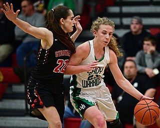 AUSTINTOWN, OHIO - FEBRUARY 27, 2017: Kayla Hovorka #23 of West Branch drives on Michelle Buser #22 of Struthers during the second half of their game Monday night at Austintown Fitch High School. DAVID DERMER | THE VINDICATOR